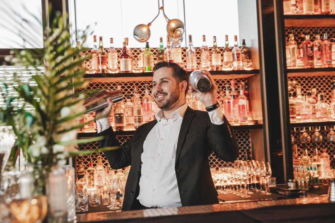 Bar Tender making cocktails 