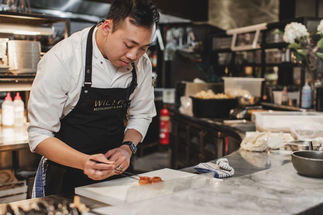 Chef plating up an entree