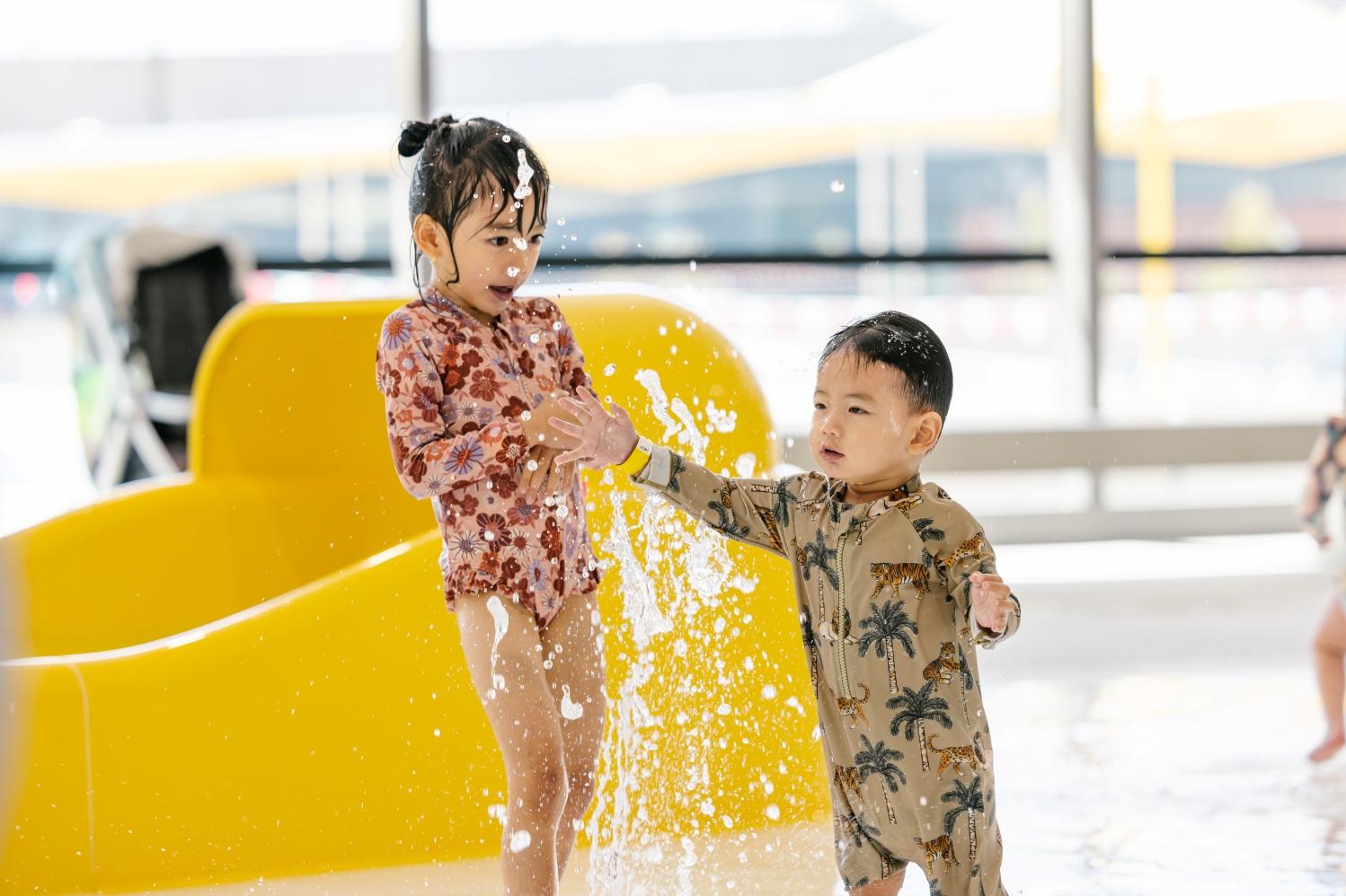 Two kids playing in water