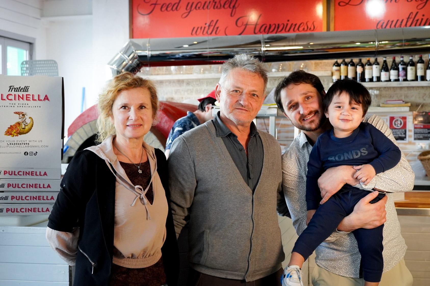 Family standing near the counter of Fratelli Pulcinella