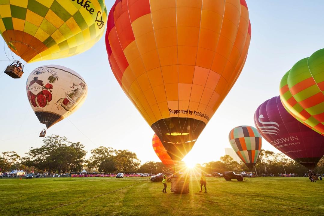 Hot air balloon in the sky in front of the sunrise