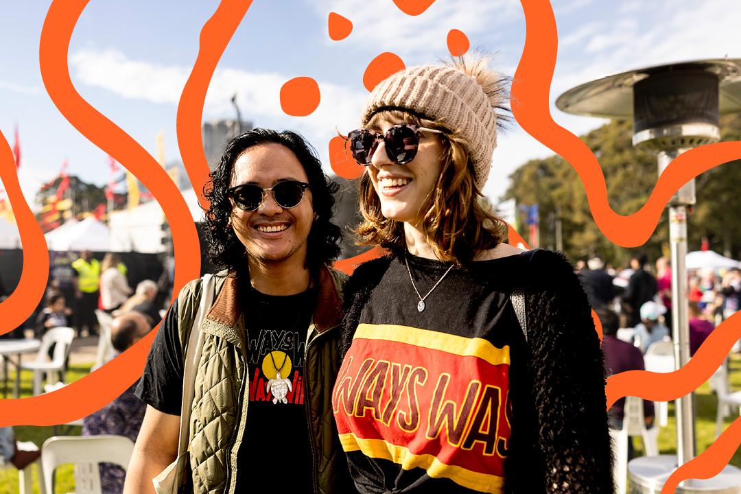 Man and woman smiling while looking into the distance