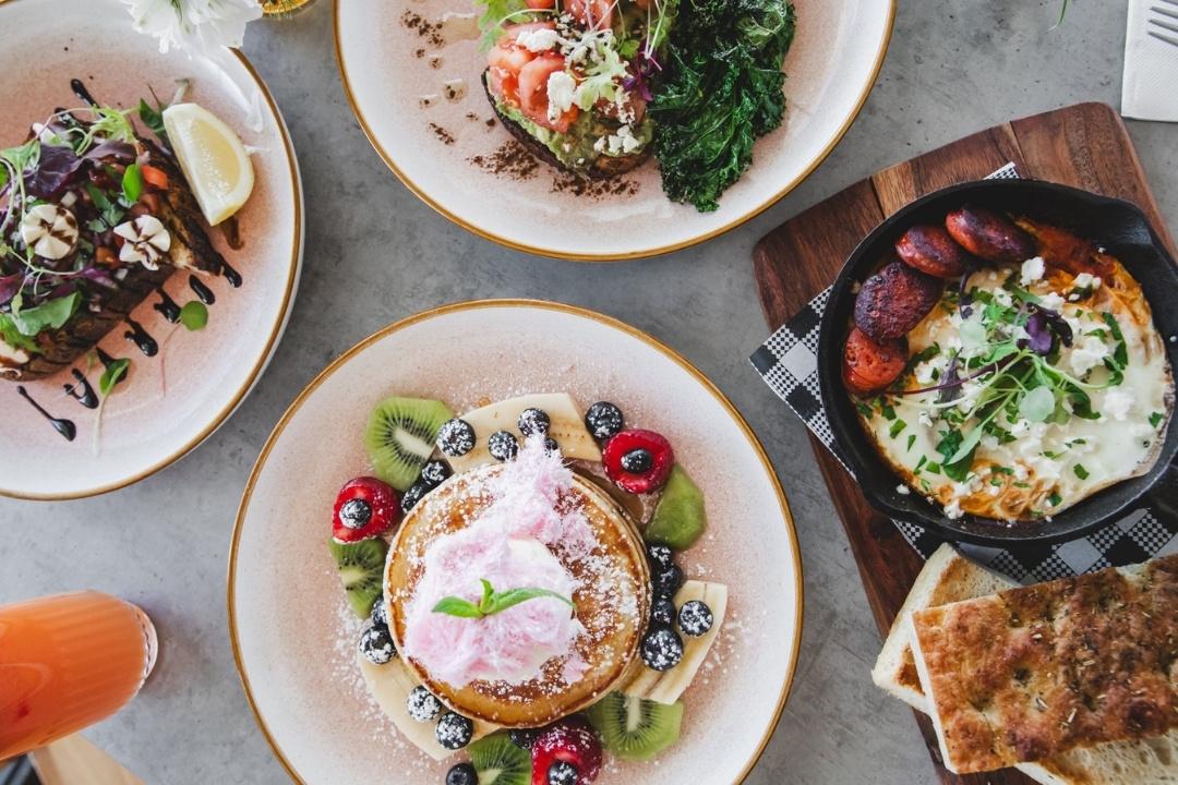 Pancakes, smashed avocado on toast and eggs