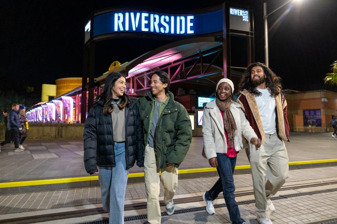 People walking out of Riverside Theatre Smiling