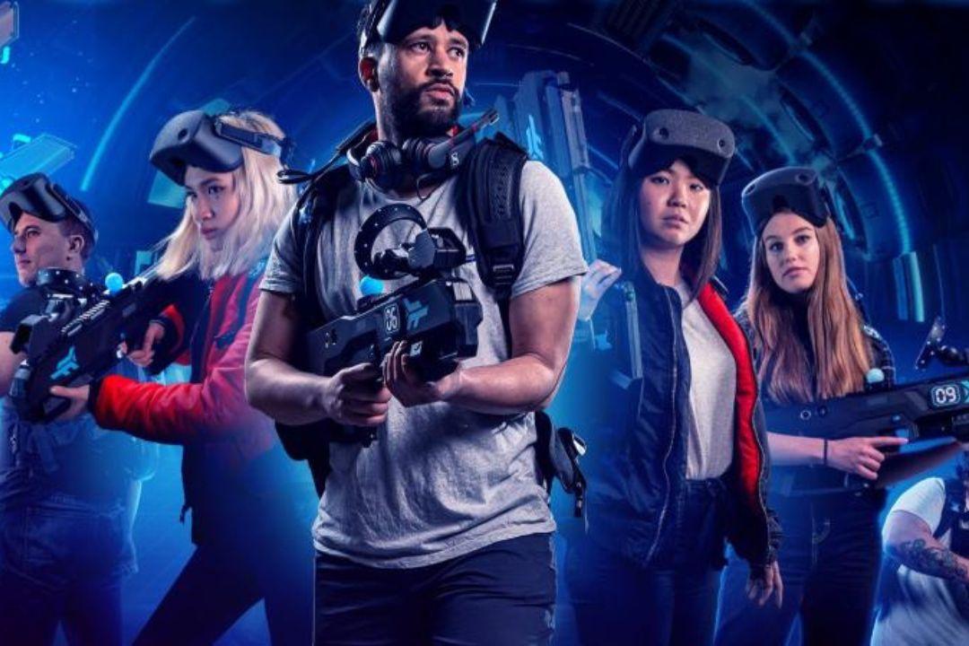 Group people with a CR headset on holding weapons, looking ready to go on a mission