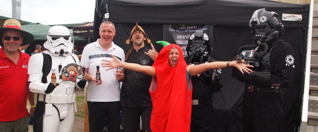 People posing for a picture at a previous chilli festival