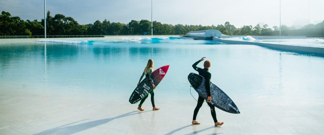 Two surfers looking out at lagoon