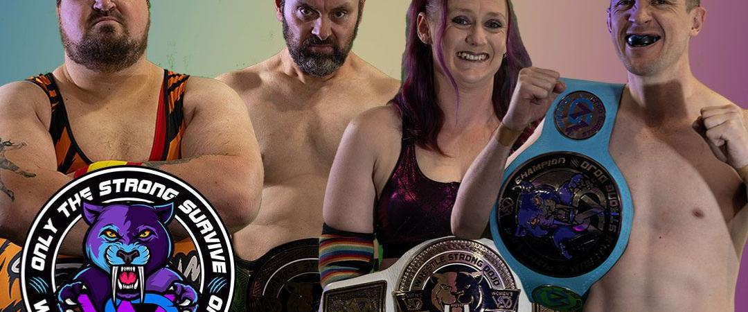 3 man and 1 woman smiling standing in fighting prositions holding big wrestling belts