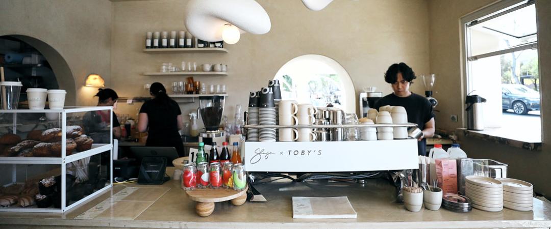 Coffee shop counter with machine on top