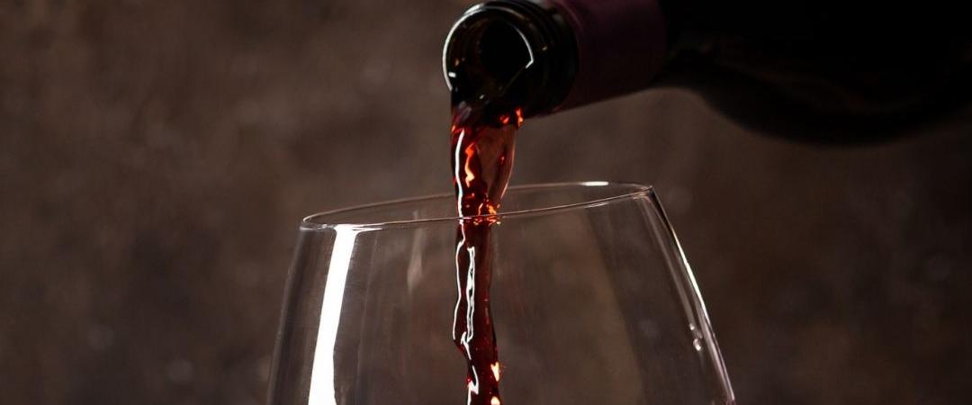 Wine being poured into a glass
