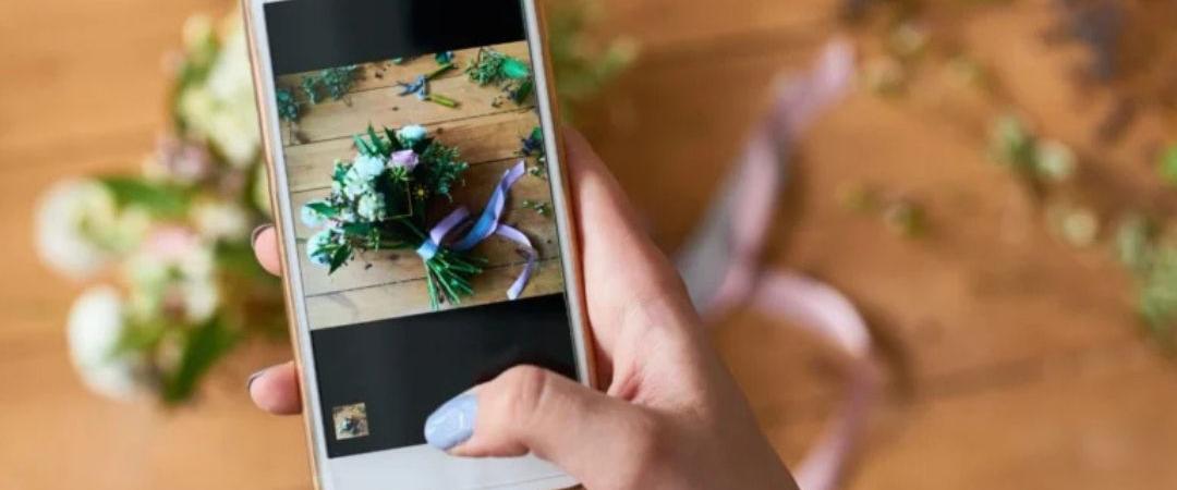 Phone taking a photo of flowers