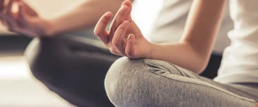 people in meditation position