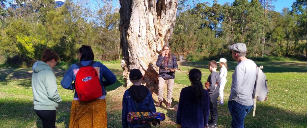 Group of people standing in front of tree on Warami Mittigar tour
