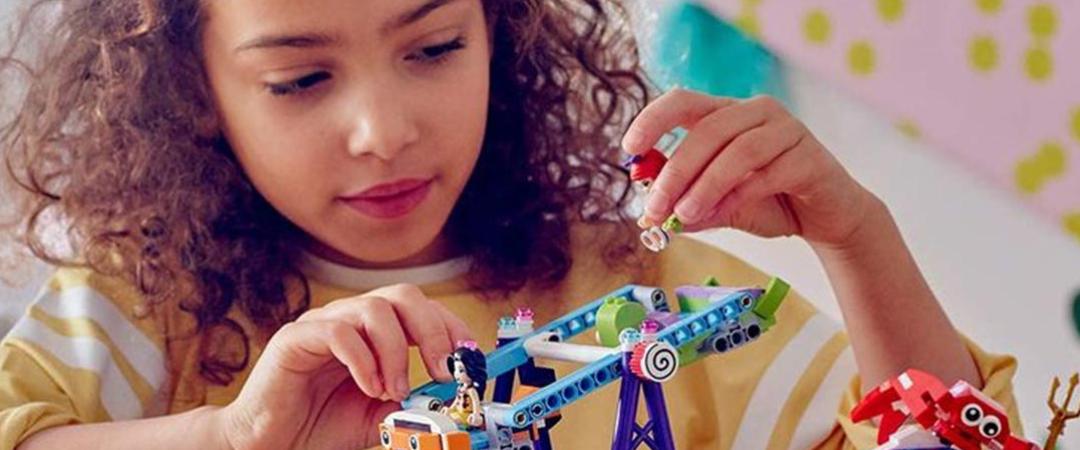 Girl playing with LEGO