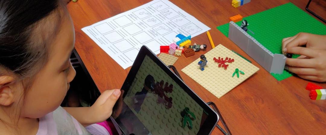 Girl on ipad creating LEGO animation