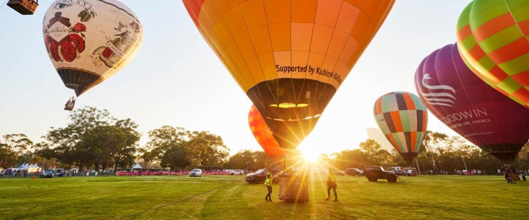 Hot air balloons in the air before a sunrise