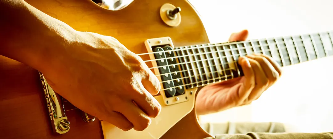 Person playing the guitar