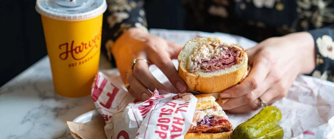 Milkshake and brisket sandwich with pickles on side
