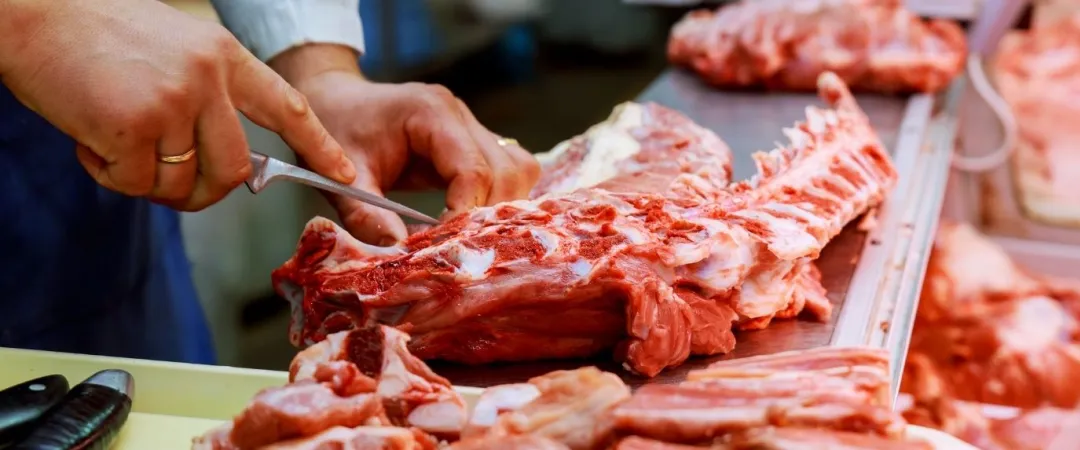 butcher preparing meat