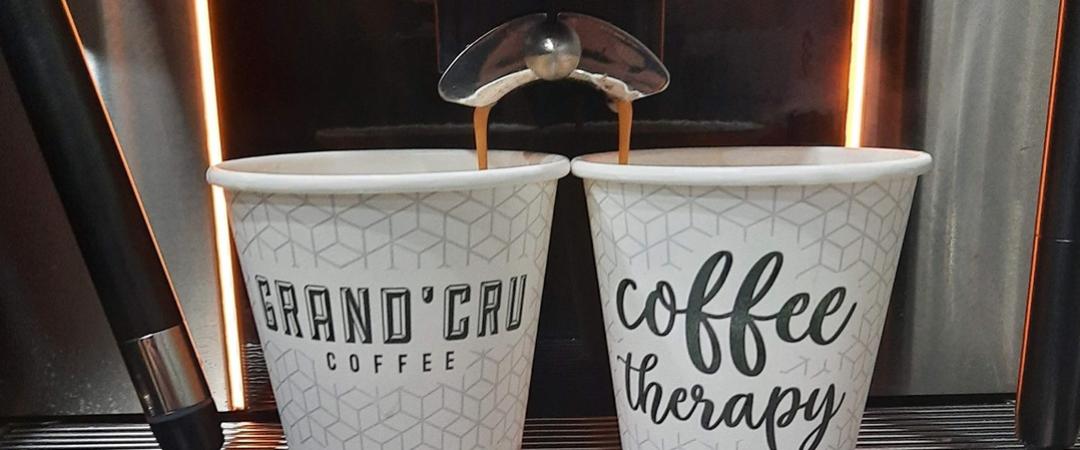 Pictured is the Mary George Espresso and co logo with the words 'mary george' written in a blood orange colour on a white background