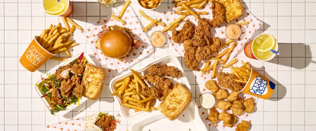 Selection of chicken and chips on a grid background