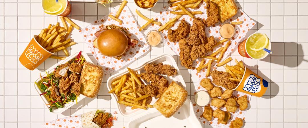 Selection of chicken and chips on a grid background