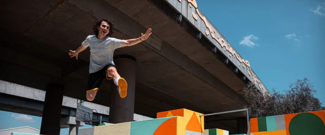 Man jumping over blocks