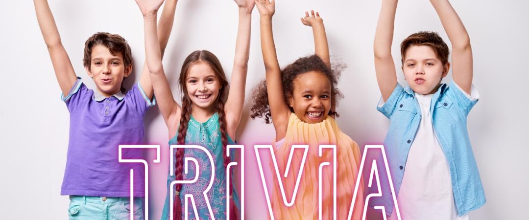 Two boys and two girls with hands in the air and the word Trivia in front of them