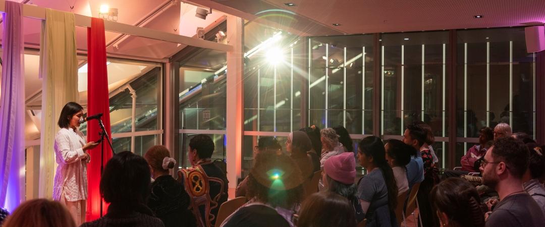 People listening to speaker on The Western Terrace