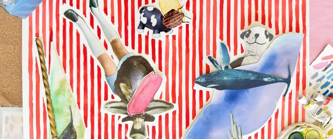 Whimsical mixed-media artwork shows a cat riding a blue whale on red-and-white stripes, surrounded by paintbrushes, palettes, and art supplies.