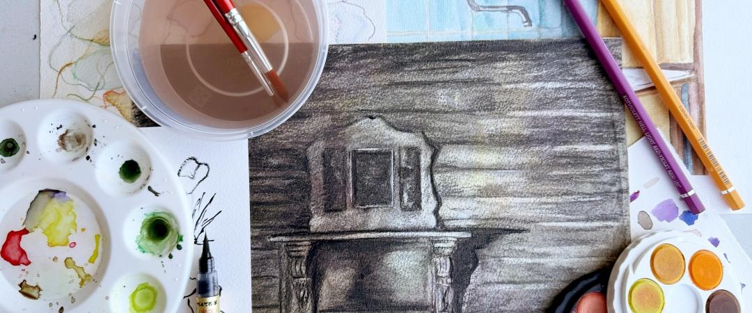 A creative workspace featuring a charcoal drawing of a fireplace, colorful sketches, watercolors, pencils, and paintbrushes. The scene is vibrant and artistic.