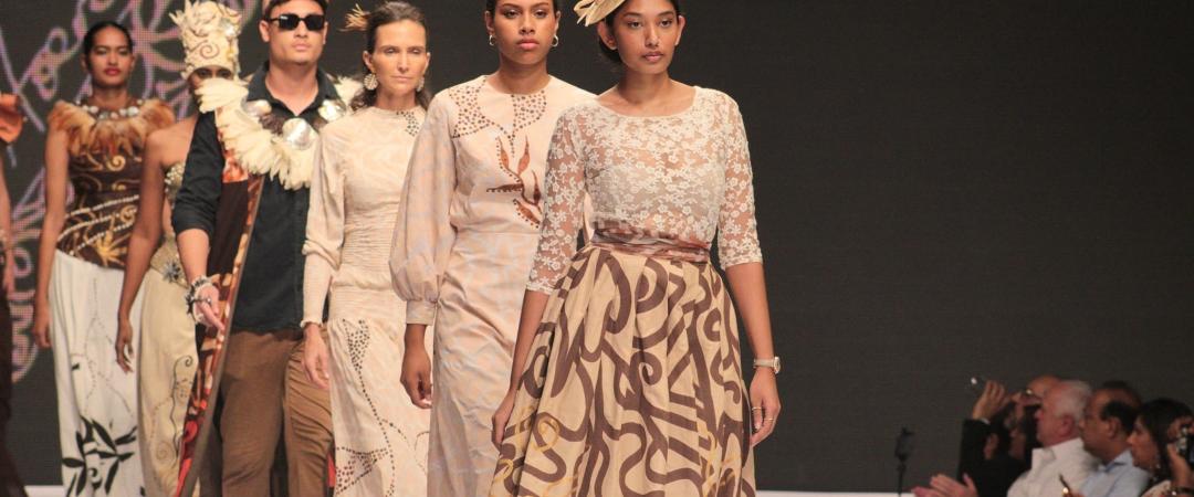 Women walking down fashion catwalk