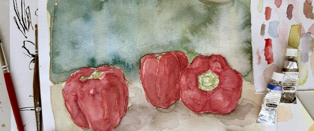 A watercolor painting of three red bell peppers on a textured background. Surrounding the artwork are paint tubes, brushes, and color swatches, conveying a creative and artistic atmosphere.