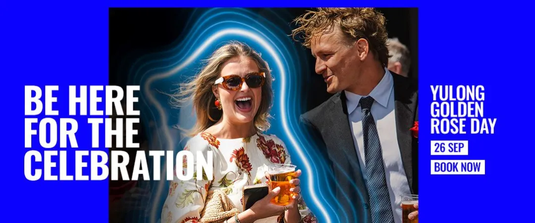 two people dressed in event attire holding drinks at a social gathering