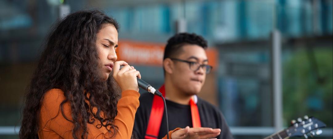 two musicians performing on stage