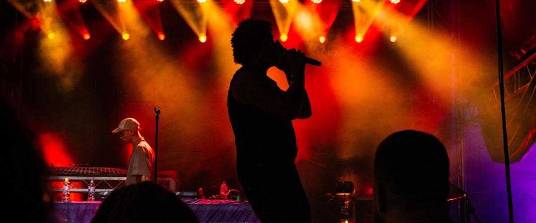 singer's silhouette performing on stage