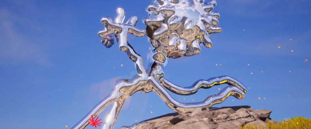 A shiny, metallic sculpture of a humanoid form running, head resembling a virus, stands on rocky terrain under a blue sky, evoking a futuristic feel.