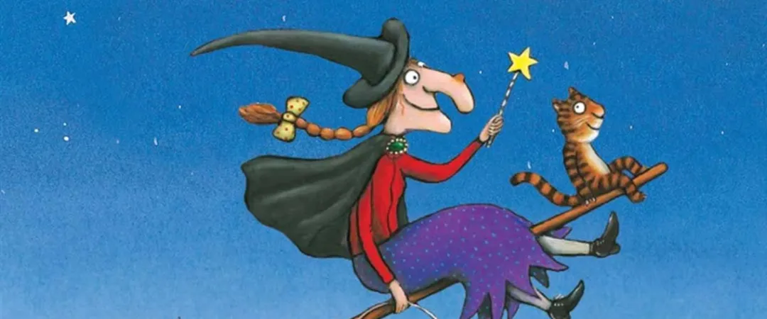 Witch on broom with star wand and cat on the end of the broom