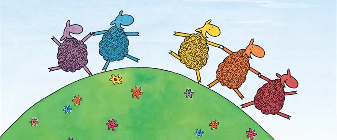  A group of sheep is running energetically up a grassy hill under a clear blue sky.