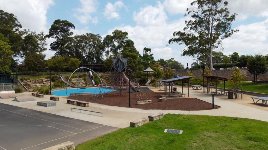 playground area with  grass and trees