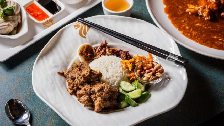 Bowl of chicken, rice and cucumber