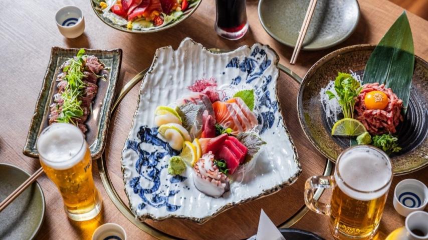 White and blue plat with fresh cuts of fish